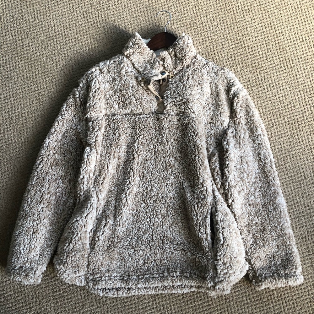 Fleece pullover with detachable hood.